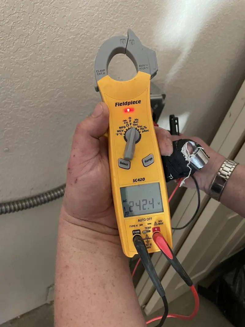 Voltage testing with clamp meter during Whole House Surge Protector in West Point
